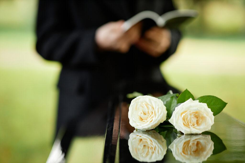 roses with person reading at funeral ceremony 2026 09 24 08 17 34 utc